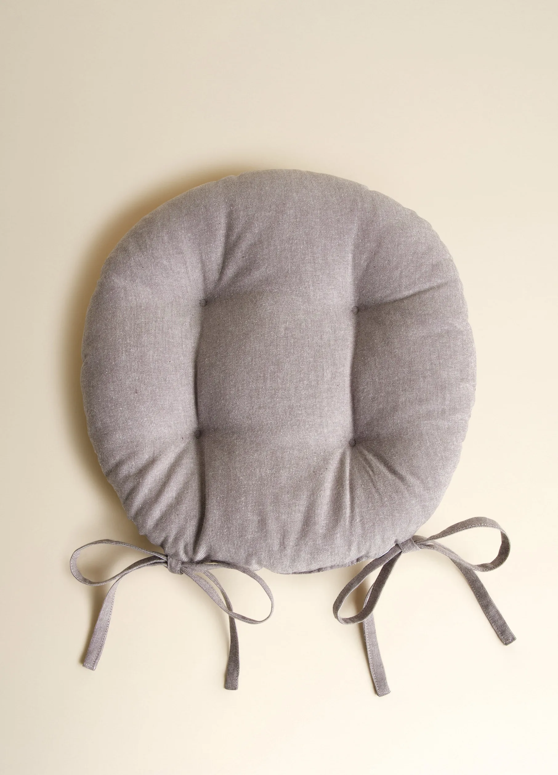 Cuscino coprisedia rotondo trapuntato